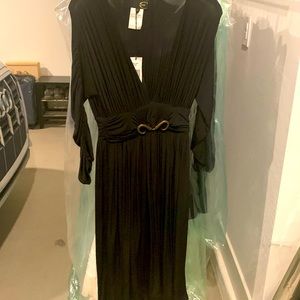 Just Cavalli black dress. Long sleeves. Pleated bottom. Size 40 (us 4-6).